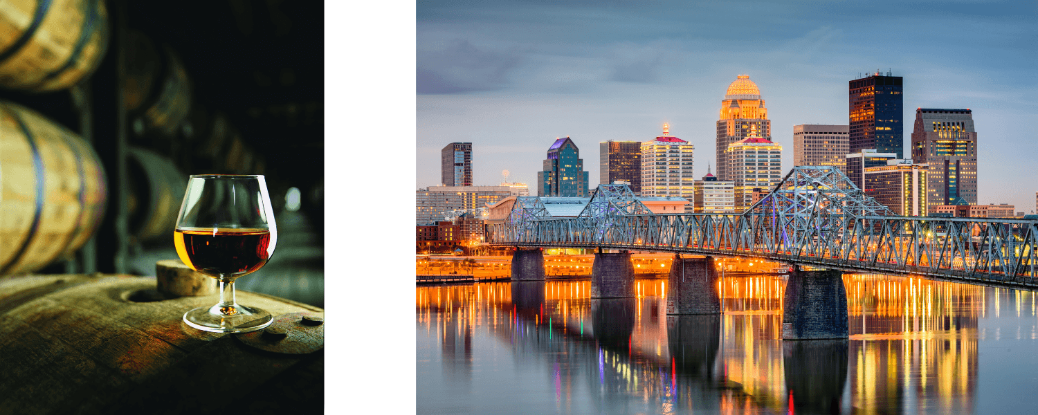 A glass of whiskey sits on a barrel in a distillery, alongside a view of a city skyline at dusk with a lit bridge reflecting on the river below.