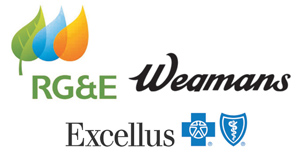 Logos for RG&E, Wegmans, and Excellus BlueCross BlueShield. RG&E features colorful leaves, Wegmans is in black script, and Excellus displays blue cross and shield symbols.