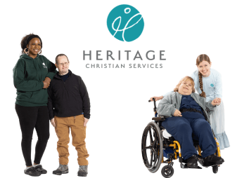 Four people smile together under the Heritage Christian Services logo; they gather joyfully, including a woman in a wheelchair, for an Anniversary Celebration with friends—one in a light-blue dress and others standing beside her.