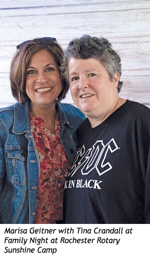 Marisa Geitner and Tina Crandall smile together at Family Night at Rochester Rotary Sunshine Camp.
